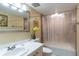 Clean bathroom with a shower/tub combo and white vanity at 19610 Gulf Blvd # 308, Indian Shores, FL 33785