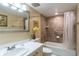 Clean bathroom with a shower/tub combo and white vanity at 19610 Gulf Blvd # 308, Indian Shores, FL 33785