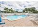 Inviting community pool with plenty of lounge chairs at 19610 Gulf Blvd # 308, Indian Shores, FL 33785