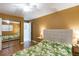 Bedroom with a queen bed and mirrored closet at 19610 Gulf Blvd # 308, Indian Shores, FL 33785