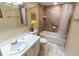 Clean bathroom with a shower/tub combo and white vanity at 19610 Gulf Blvd # 308, Indian Shores, FL 33785