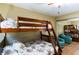 Bedroom featuring a bunk bed and ceiling fan at 19610 Gulf Blvd # 308, Indian Shores, FL 33785