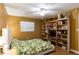 Bedroom with queen bed, built-in shelves, and ceiling fan at 19610 Gulf Blvd # 308, Indian Shores, FL 33785