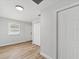 Bedroom with wood-look floors, closet and window at 5425 Waters Edge Dr, New Port Richey, FL 34653