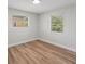 Simple bedroom with new flooring and neutral wall colors at 5425 Waters Edge Dr, New Port Richey, FL 34653