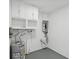 Laundry room with washer, dryer hookups, and storage cabinets at 5425 Waters Edge Dr, New Port Richey, FL 34653