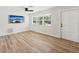 Bright living room with hardwood floors and built-in shelving at 5425 Waters Edge Dr, New Port Richey, FL 34653