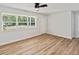 Spacious living room featuring hardwood floors and large windows at 5425 Waters Edge Dr, New Port Richey, FL 34653