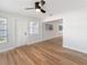 Open living room with wood-look floors and access to other rooms at 5425 Waters Edge Dr, New Port Richey, FL 34653