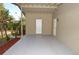 Covered back porch with storage and access to yard at 8214 Alafia Ridge Rd, Riverview, FL 33569