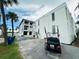 Exterior view showing building and golf cart at 108 14Th Ave # 3, St Pete Beach, FL 33706