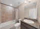 Bathroom with shower/tub combo and granite vanity at 31980 Goddard Dr, Wesley Chapel, FL 33543