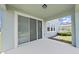 Covered patio with sliding glass doors at 31980 Goddard Dr, Wesley Chapel, FL 33543