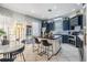 Modern kitchen with dark blue cabinets, a large island, and stainless steel appliances at 17809 Sandpine Trace Way, Tampa, FL 33647