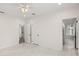Bright bedroom with tile floors and multiple doors at 850 Mandalay Ave, Clearwater Beach, FL 33767