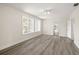 Large living area with vinyl plank flooring and access to other rooms at 850 Mandalay Ave, Clearwater Beach, FL 33767