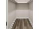 Spacious closet with wood-look flooring and shelving at 850 Mandalay Ave, Clearwater Beach, FL 33767