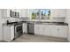 Updated kitchen, featuring stainless steel appliances and granite countertops at 850 Mandalay Ave, Clearwater Beach, FL 33767