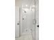 Walk-in shower with white tile and patterned floor at 850 Mandalay Ave, Clearwater Beach, FL 33767