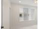 Room with tile floors and large window with blinds at 850 Mandalay Ave, Clearwater Beach, FL 33767