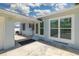 Back patio with access to the backyard at 850 Mandalay Ave, Clearwater Beach, FL 33767