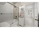 Clean bathroom with tub, shower, and granite vanity at 850 Mandalay Ave, Clearwater Beach, FL 33767