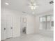 Bright bedroom with tile floors and ceiling fan at 850 Mandalay Ave, Clearwater Beach, FL 33767