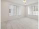 Spacious bedroom with tile floors and two windows at 850 Mandalay Ave, Clearwater Beach, FL 33767