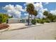Cute bungalow with a large front yard, driveway, and garage at 850 Mandalay Ave, Clearwater Beach, FL 33767