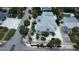 Aerial view showing house, landscaping, and street at 850 Mandalay Ave, Clearwater Beach, FL 33767
