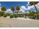 House exterior showcasing tropical landscaping and driveway at 850 Mandalay Ave, Clearwater Beach, FL 33767