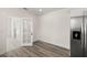 Eat-in kitchen with stainless steel appliances and vinyl plank flooring at 850 Mandalay Ave, Clearwater Beach, FL 33767