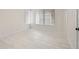 Well-lit bedroom featuring tile floors and large window at 850 Mandalay Ave, Clearwater Beach, FL 33767