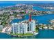 Aerial view of waterfront condo building with a pool at 420 64Th Ave # A, St Pete Beach, FL 33706