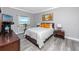 Bright bedroom with ocean view, comfortable bed, and stylish nightstands at 420 64Th Ave # A, St Pete Beach, FL 33706