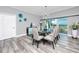 Elegant dining room with glass table and ocean view at 420 64Th Ave # A, St Pete Beach, FL 33706