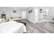 Large bedroom with hardwood floors and access to bathroom at 420 64Th Ave # A, St Pete Beach, FL 33706