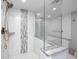 Modern bathroom with walk-in shower and bathtub at 420 64Th Ave # A, St Pete Beach, FL 33706