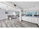 Open floor plan showing modern kitchen and living room with ocean view at 420 64Th Ave # A, St Pete Beach, FL 33706