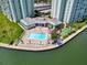 Inviting pool area with lounge chairs and shuffleboard at 420 64Th Ave # A, St Pete Beach, FL 33706