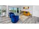 Living room with blue chairs, orange couch, and ocean view at 420 64Th Ave # A, St Pete Beach, FL 33706