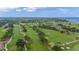 Aerial view of the golf course with lush greens and fairways at 6 Hibiscus Ln, Belleair, FL 33756