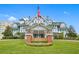 Historic Belleview Inn with manicured lawn and flag at 6 Hibiscus Ln, Belleair, FL 33756