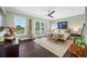 Main bedroom with a king-size bed and access to a balcony at 6 Hibiscus Ln, Belleair, FL 33756