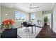 Bright home office with hardwood floors and built-in desk at 6 Hibiscus Ln, Belleair, FL 33756