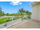 Private balcony with pond and neighborhood views at 6 Hibiscus Ln, Belleair, FL 33756