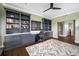 Home office with built-in shelving and hardwood floors at 6 Hibiscus Ln, Belleair, FL 33756