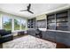 Spacious home office with built-in shelving and a large desk at 6 Hibiscus Ln, Belleair, FL 33756