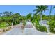 Community entrance with brick columns and landscaping at 6 Hibiscus Ln, Belleair, FL 33756