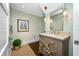 Elegant powder room with unique vanity and decorative mirror at 6 Hibiscus Ln, Belleair, FL 33756